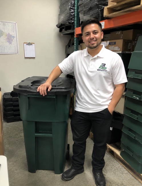 Bravix team member with rental bins in the warehouse